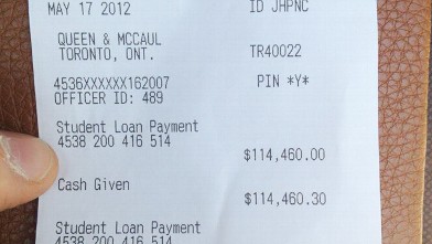 PHOTO: Alex Kenjeev recently paid his $114,460 student loan in cash.