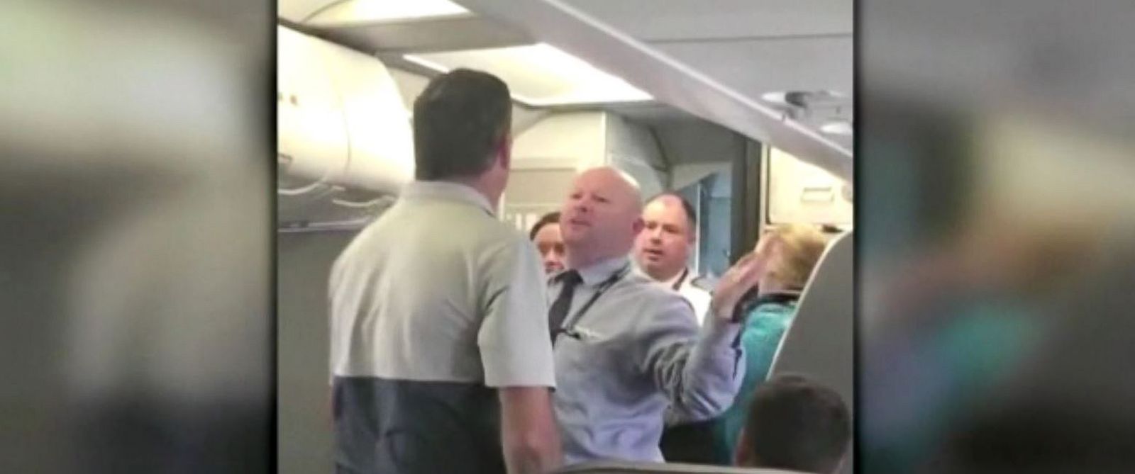 PHOTO: A passenger on an American Airlines aircraft in San Francisco on April 21, 2017, captured a heated moment between a flight attendant and passengers.