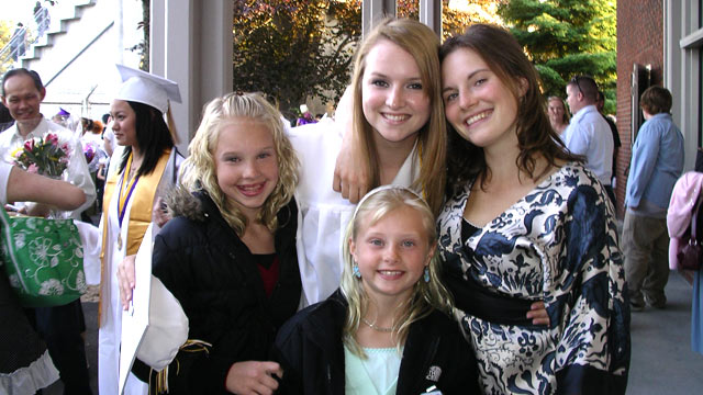 PHOTO: In this family photo, Amanda poses with her three sisters during Deanna's graduation ceremony from high school.
