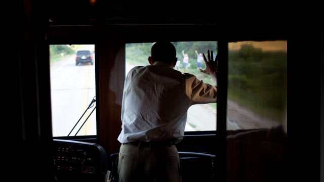 PHOTO: President Barack Obama waves to people along the road in Decorah, Iowa, Aug. 15, 2011, during a three-day bus tour in the Midwest focusing on ways to grow the economy.