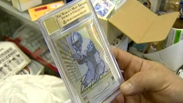 PHOTO: Todd and Ula Nelkin of Houston, Tex., are auctioning a one-of-a-kind, double autographed football card of Barry Sanders and Walter Payton in order to pay for a last attempt at IVF.