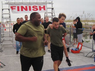 Marine Carries Fla. Boy Over Finish Line