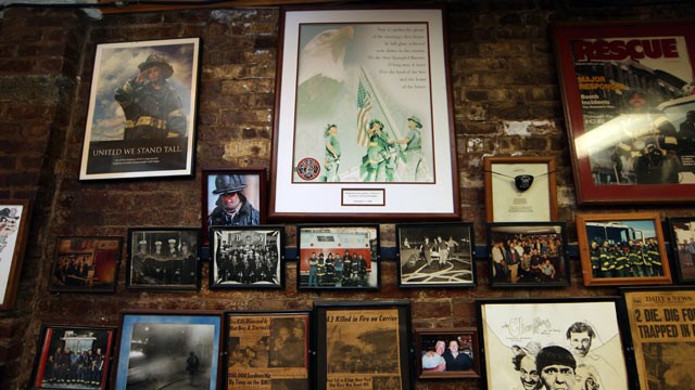 PHOTO:&nbsp;A plaque featuring the famous photograph of three firefighters hoisting a flag out of debris, in Sept. 11, 2001, hangs on the wall of Rescue Company 2, in Brooklyn, New York, where one of the men in the photo still works as a firefighter.