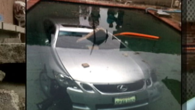 PHOTO: The Diaz family woke up on May 13, 2012 to find that a Lexus had crashed through their backyard and landed in their pool overnight in La Puente, Califronia.