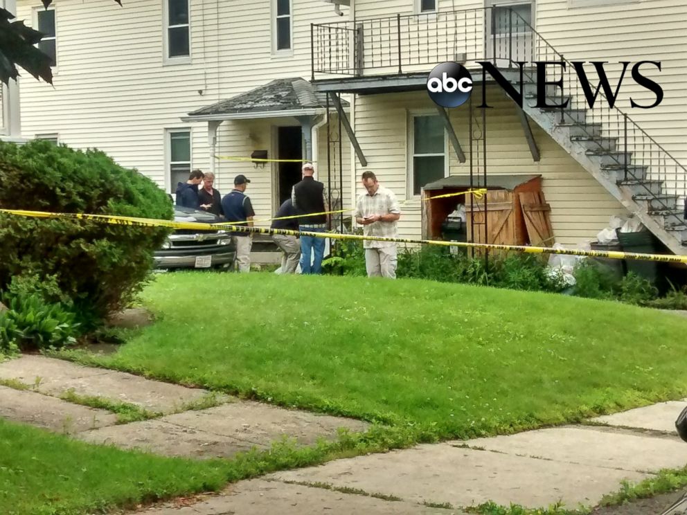 PHOTO: Federal agents search a home in Adams, Mass. on July 4.