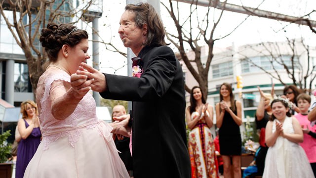 PHOTO: Dallas Wiens and Jamie Nash have their first dance after getting married at their reception in Forth Worth, Texas, March 30, 2013.