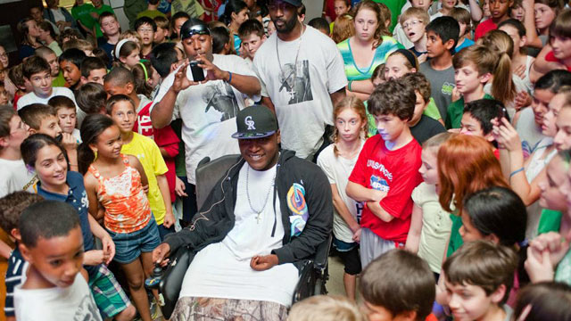 PHOTO: Darius Weems, an aspiring rapper who suffers from Duchenne Muscular Dystrophy, is surrounded by fans at the Jamesville Dewitt Middle School in Syracuse, N.Y.