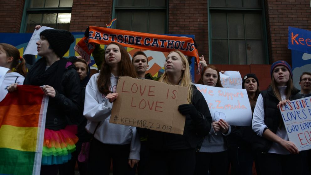 PHOTO: Alumni and students from Seattles Eastside Catholic School protest Sunday, Dec. 22, 2013, to demand the reinstatement of former vice principal Mark Zmuda.