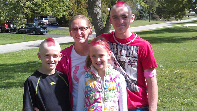 PHOTO: Stacey Foster, 33, with her children, (from left to right), Trevor, 11, Jairis, 9, Caleb, 14. All have dyed their hair pink in support of their mother, who was diagnosed with breast cancer a year ago.