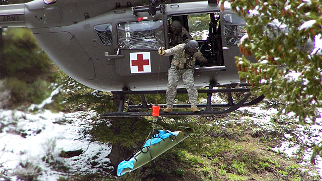 PHOTO: Brian Brown, wife Jayann Brown, and adult daughter being rescued after their small Cessna plane crashed into trees in the snowy mountains of Idaho.