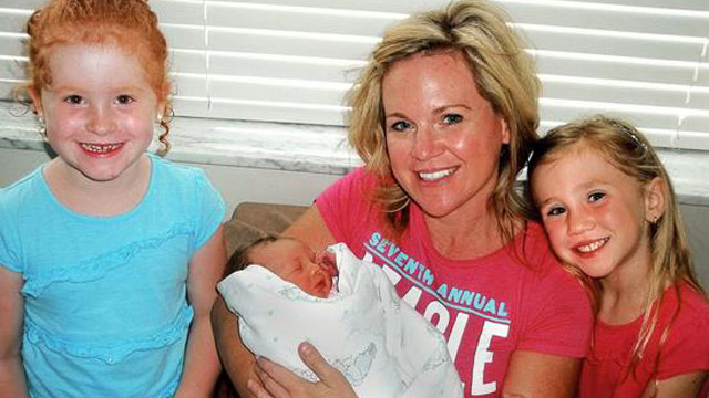 PHOTO: Jacque Waller with one of her triplets