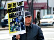 PHOTO Alleged Discovery Channel gunman James Lee protests on Georgia Avenue in front of The Discovery Channel in this February 14, 2008 file photo.