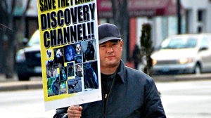 PHOTO Alleged Discovery Channel gunman James Lee protests on Georgia Avenue in front of The Discovery Channel in this February 14, 2008 file photo.