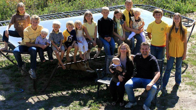 PHOTO: Chris and Wendy Jeub, with their 16 children, seen here in their Facebook page profile picture.
