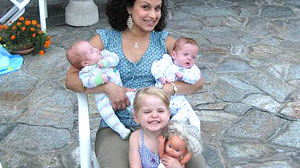 PHOTO Surrogate mother Karma Daigle shows off three of her five children, Zoe, Sebastiaan and Lukas, whom she carried for a gay couple who live overseas.