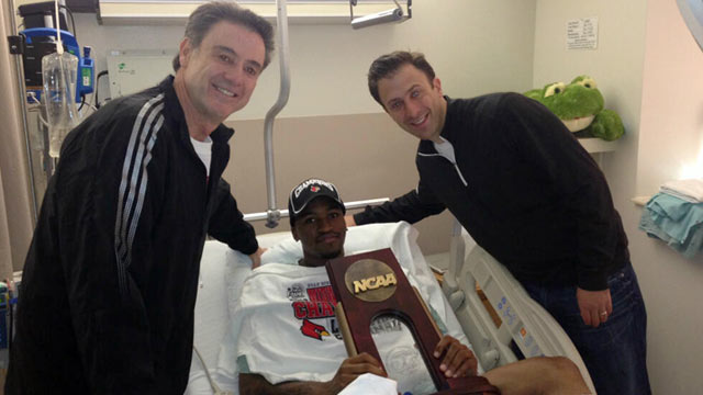 PHOTO: Louisville Coach Rick Pitino and Richard Pitino visit guard Kevin Ware at Methodist Hospital in Indianapolis, April 1, 2013.