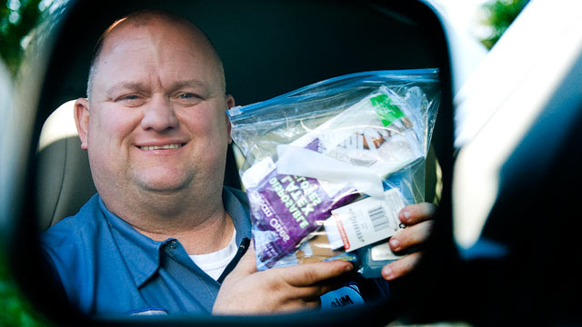 PHOTO: Mike Hawthorne of Somerdale, N.J., a truck driver who helped deliver three babies, holds a kit that he carries with him and uses while helping with child birth, April 6, 2012.
