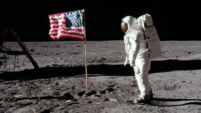 PHOTO: Buzz Aldrin stands next to a U.S. flag after it was placed on the moon.