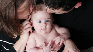 PHOTO After their embryo was mistakenly planted into another woman, the woman, Carolyn Savage, agreed to give them their child after giving birth.