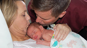 PHOTO: Shown here is Carolyn and Sean Savage with their baby.