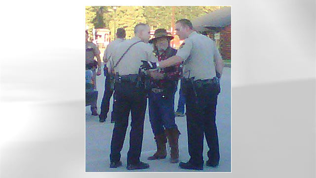 PHOTO: Pennington County deputies question people at the scene of the Wild West-style shootout in Hill City, South Dakota June 17, 2011.