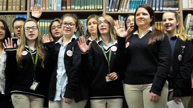 PHOTO: Female students at Queen of Peace High School in North Arlington take a pledge not to swear for the month of February.