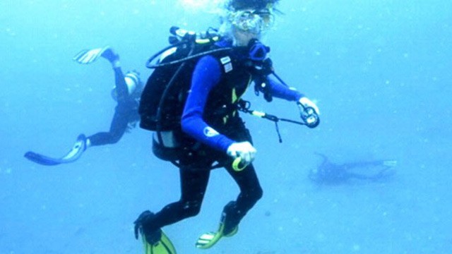 PHOTO: In this photo Tina Watson's body sinks to the bottom of the ocean floor while husband Gabe Watson surfaces. Gabe Watson and his then-fiancee, Tina, pose on their engagement, (inset).