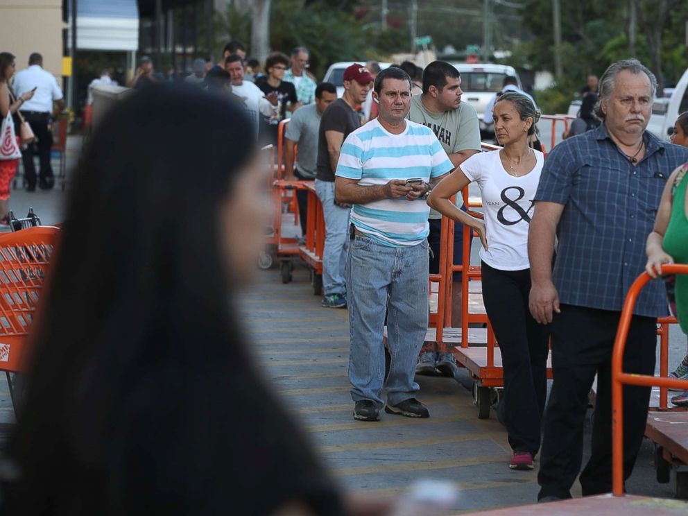 PHOTO: People wait in line to purchase plywood at The Home Depot as they prepare for Hurricane Irma, Sept. 6, 2017, in Miami.