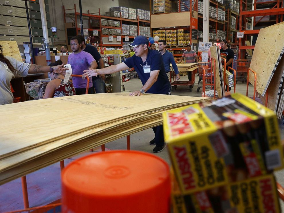 PHOTO: People purchase plywood at The Home Depot as they prepare for Hurricane Irma, Sept. 6, 2017, in Miami. 