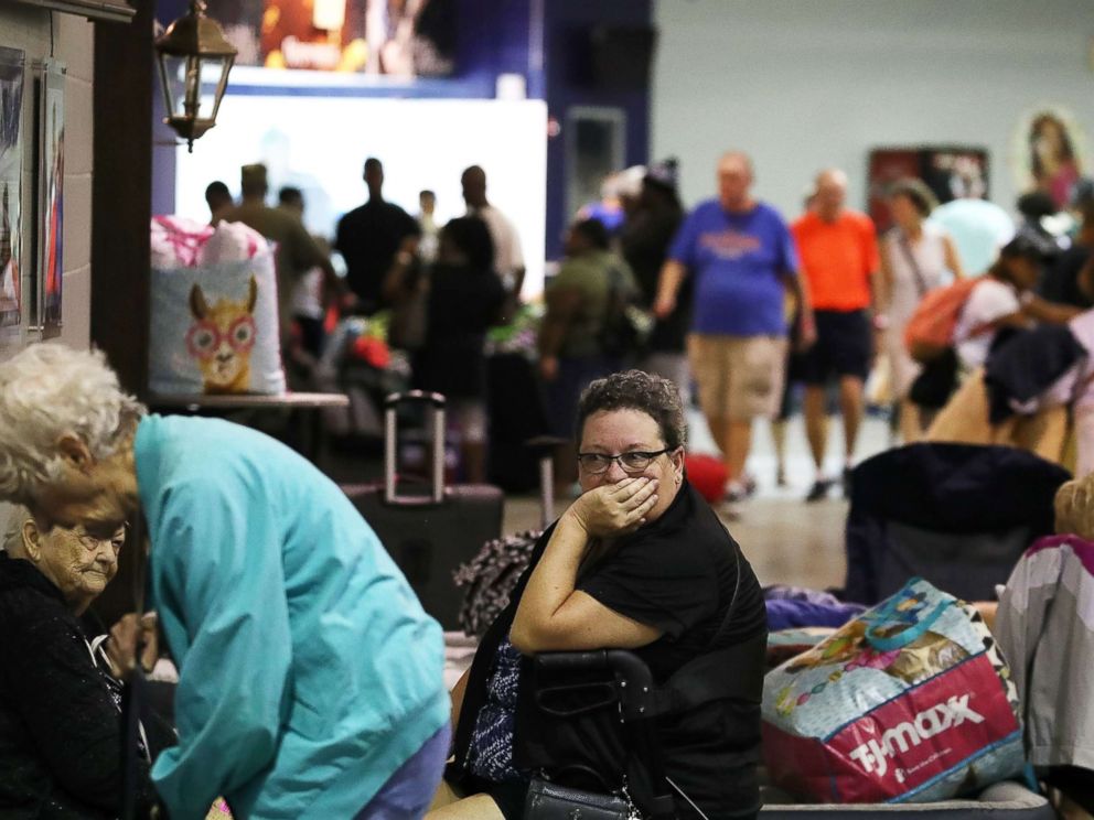 PHOTO: Evacuees sit inside of the Germain Arena that is serving as a shelter from the approaching Hurricane Irma, Sept. 9, 2017 in Estero, Florida. 