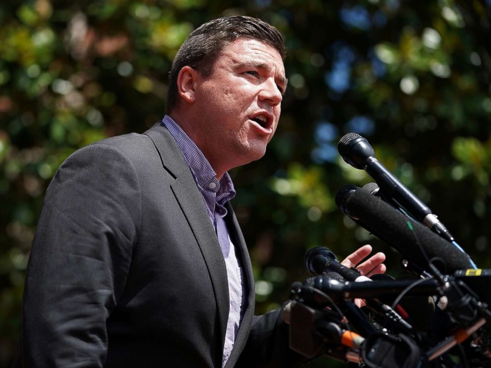 PHOTO: Jason Kessler, an organizer of Unite the Right rally, tries to speak while being shouted down by counter-protesters outside the Charlottesville City Hall, Aug. 13, 2017 in Charlottesville, Va. 