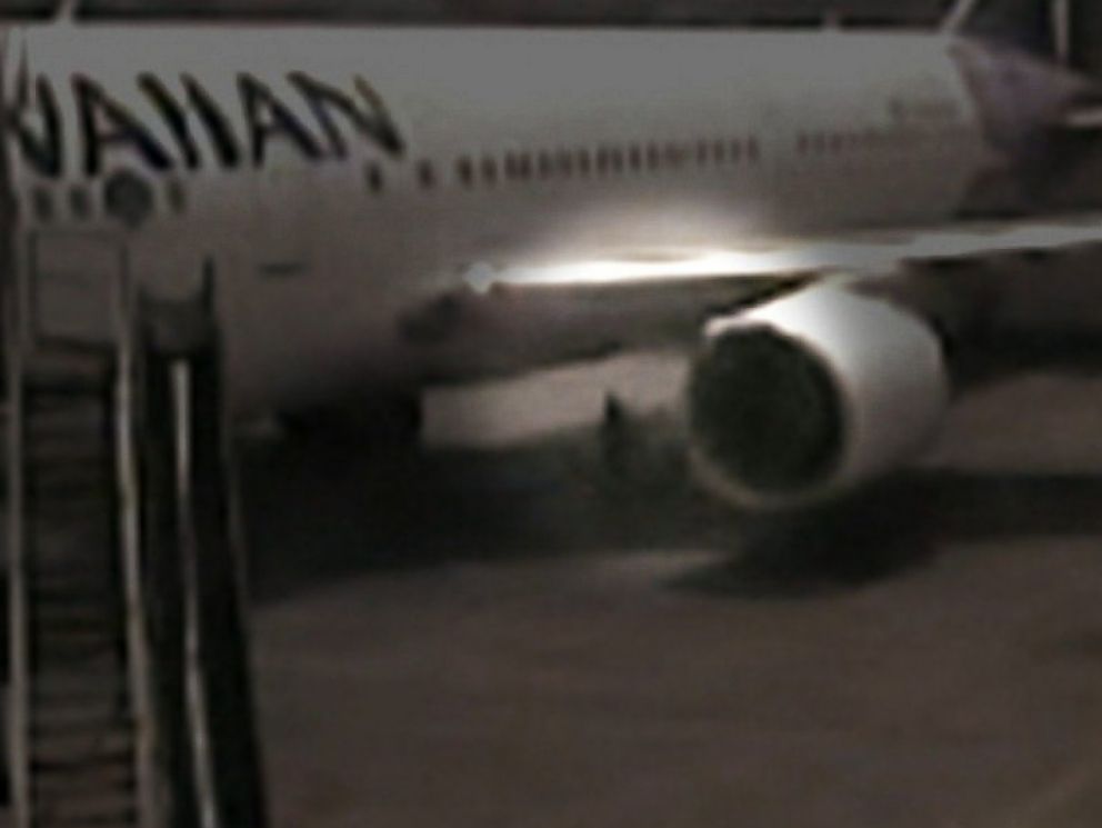 PHOTO: Surveillance video shows a California teenager who hid in the wheel well of a Hawaiian Airlines plane at Mineta San Jose International Airport in April, 2014.