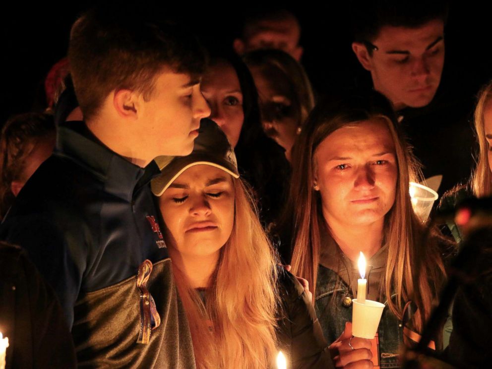 PHOTO: People attend a vigil for the victims of a fatal shooting at Marshall County High School, Jan. 25, 2018, at Mike Miller County Park in Benton, Ky. 