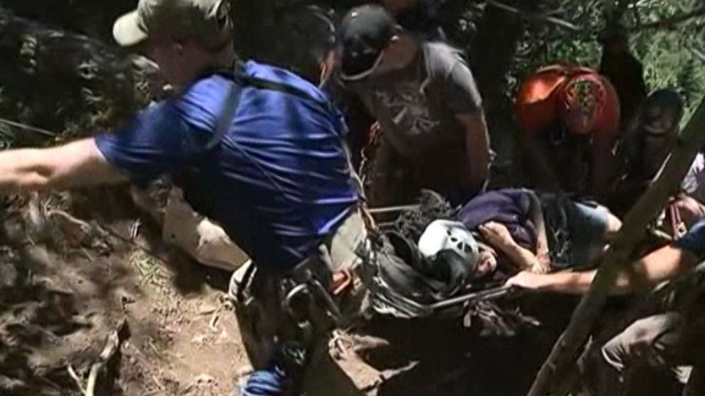 New Mexico rescuers rappelled down steep and rocky terrain to retrieve the woman who fell 30 feet.