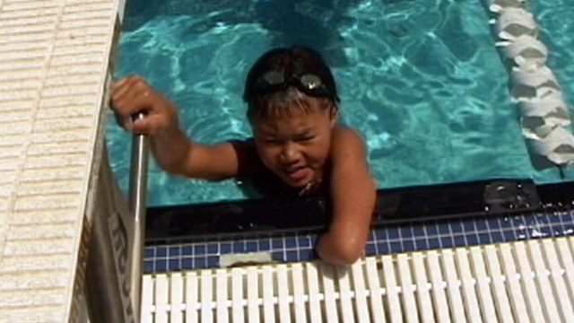 VIDEO: One-armed swimmer Ben Ramirez, 10, has won gold and bronze medals for his team.