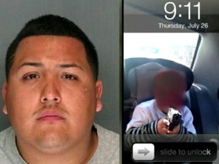 Watch: Raid Yields Photo of Suspect's Son, 6, Pointing Gun