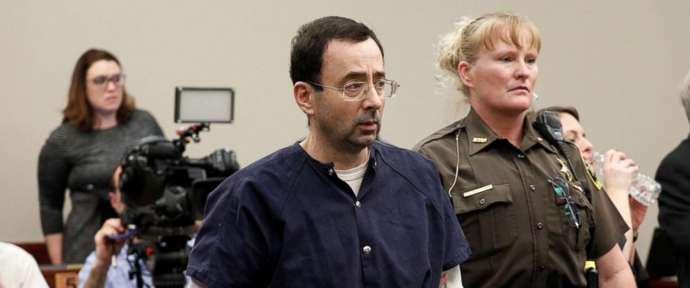 PHOTO: Larry Nassar, a former team USA Gymnastics doctor, who pleaded guilty in Nov. 2017 to sexual assault charges, is led from the courtroom after listening to victim testimony during his sentencing hearing in Lansing, Mich., Jan. 23, 2018. 