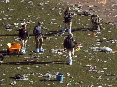 PHOTO: Investigators walk through debris on festival grounds across the street from the Mandalay Bay Resort and Casino, Oct. 3, 2017, in Las Vegas.