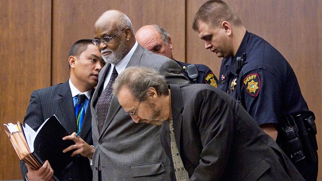 PHOTO: Ronald Bridgeforth handcuffed by deputies in court