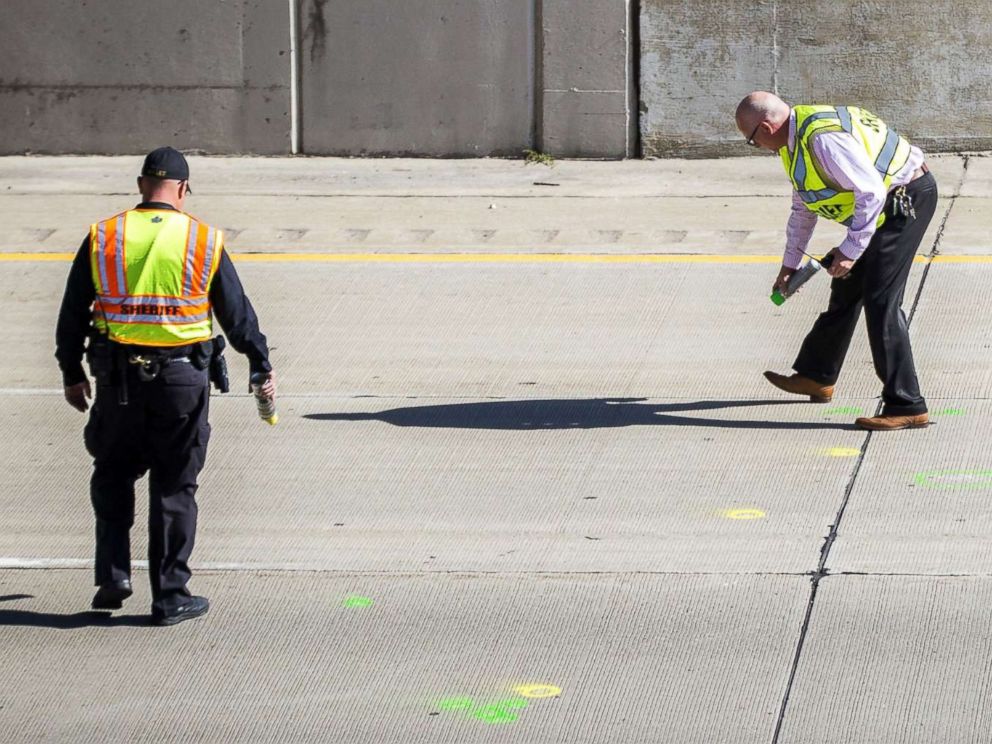 PHOTO: Genesee County Sheriffs Officers investigate the scene of a traffic fatality, Oct. 20, 2017, in Vienna Township, Mich. on Interstate 75. A rock thrown from a highway overpass smashed a car windshield and killed a 32-year-old man on Oct. 18.
