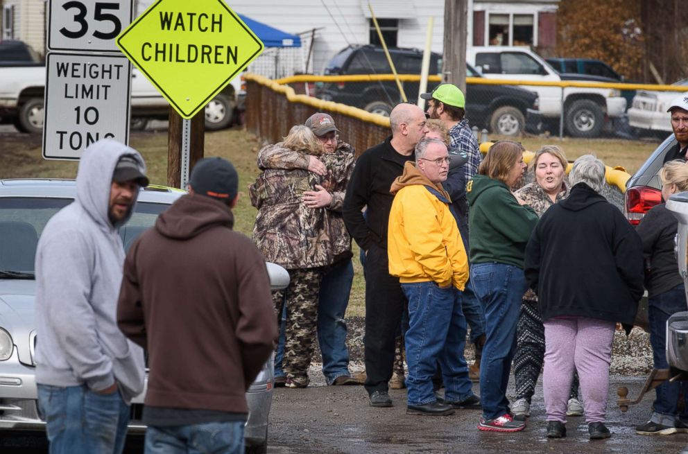 PHOTO: Family members and friends console each other near Eds Car Wash where several people were found dead and one injured after a shooting, Jan. 28, 2018 in Melcroft, Pa.