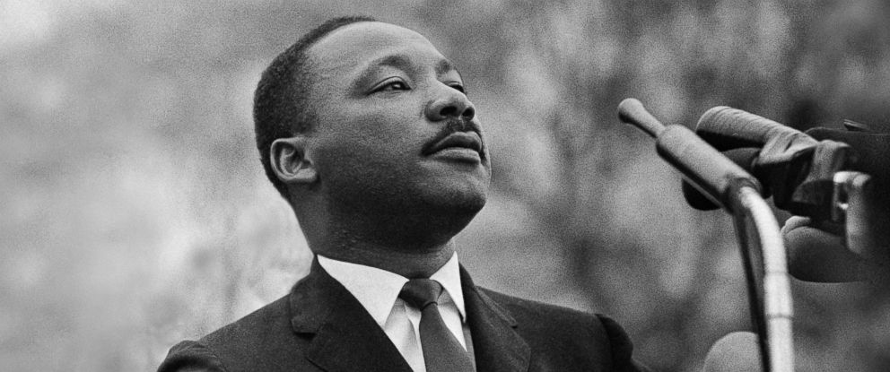 PHOTO: Dr. Martin Luther King, Jr. in front of the Montgomery, Alabama state capital building on March 25, 1965.