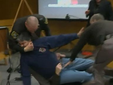 Victims' father lunges at Larry Nassar in court