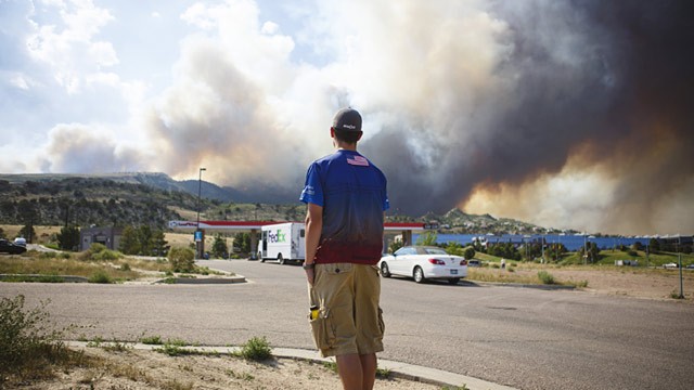 PHOTO: Man watches wildfire from Colorado Springs