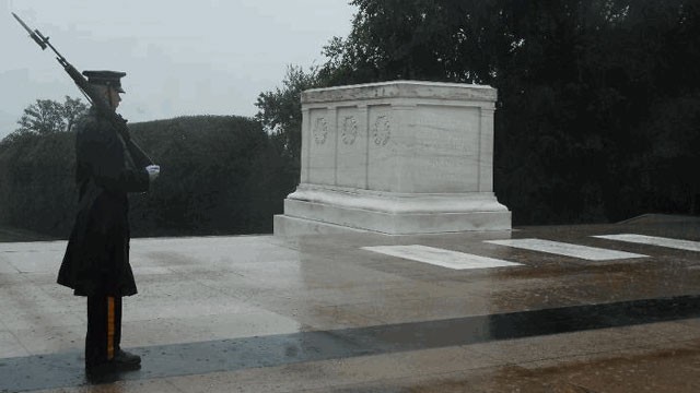 PHOTO: A lone Tomb Sentinel, 3d U.S. Infantry Regiment (The Old Guard), walks his tour in humble reverence during Hurricane Irene in Arlington National Cemetery, Va., Aug 27.
