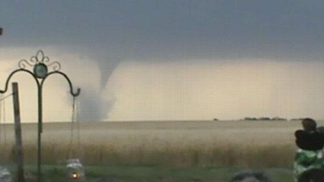 VIDEO: Caleb and Candra Pence celebrate their wedding with a tornado in the background.