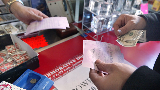PHOTO: A lottery player buys a Powerball ticket in this file photo from December 30, 2003.
