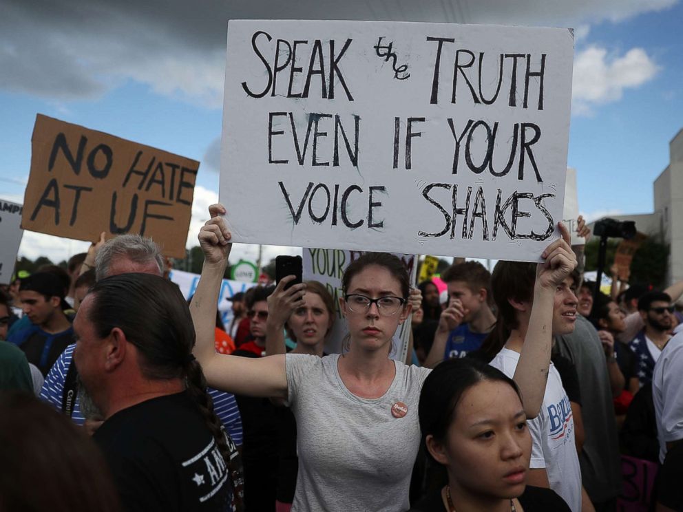 PHOTO: Protesters react to white nationalist Richard Spencer, who popularized the term alt-right as he speaks at the Curtis M. Phillips Center for the Performing Arts, Oct. 19, 2017 in Gainesville, Fla.