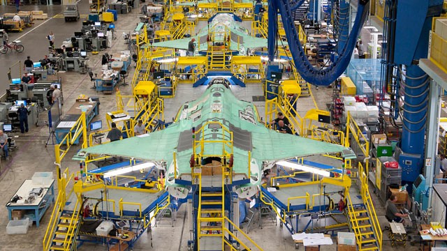 PHOTO: Workers can be seen on the moving line and forward fuselage assembly areas for the F-35 Joint Strike Fighter at Lockheed Martin Corps factory located in Fort Worth, Texas, Oct. 13, 2011.