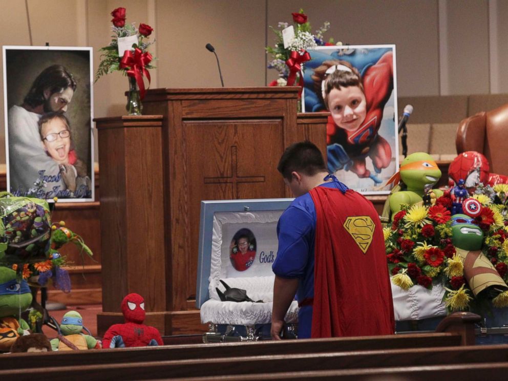 PHOTO: Dale Hall, dressed in a Superman outfit, stands before the casket during the funeral for his brother 6-year-old Jacob Hall at Oakdale Baptist in Townville, South Carolina, Oct. 5, 2016. 